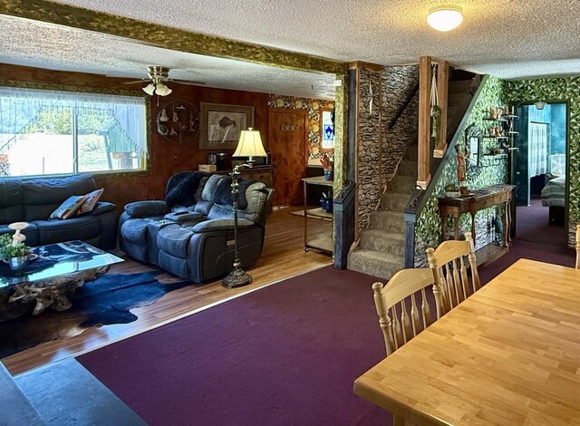 10 Cliffside Dr, Ramah, NM 87321 - living room featuring a textured ceiling, ceiling fan, wood finished floors, and stairway