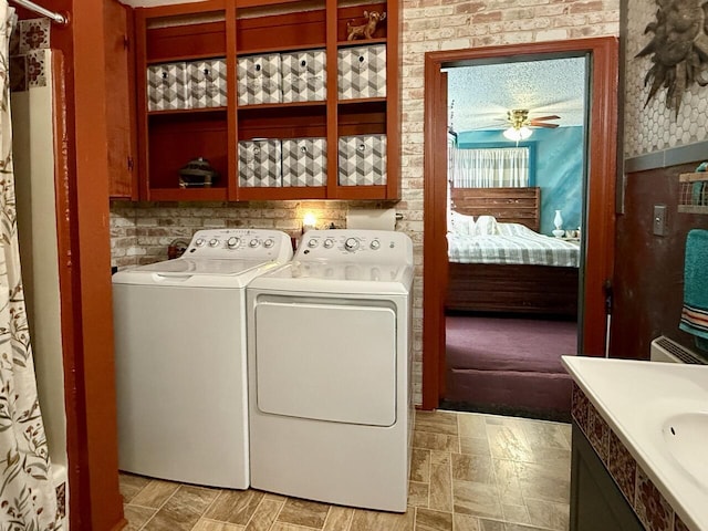 10 Cliffside Dr, Ramah, NM 87321 - washroom with separate washer and dryer, laundry area, ceiling fan, and a sink