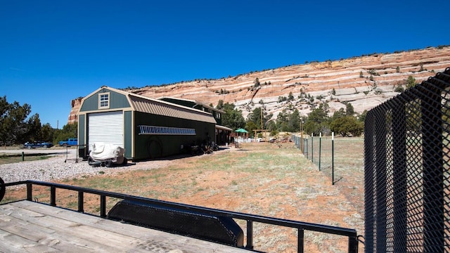 10 Cliffside Dr, Ramah, NM 87321 - view of yard featuring a mountain view, fence, and an outbuilding