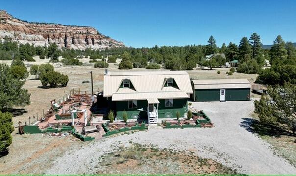 10 Cliffside Dr, Ramah, NM 87321 - view of front facade with a garage and driveway
