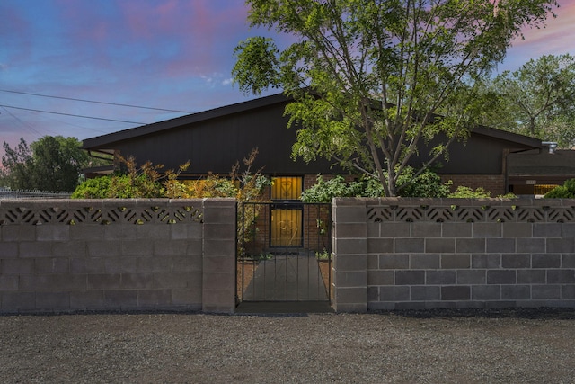 view of gate featuring a fenced front yard