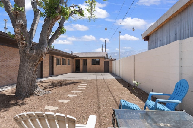 exterior space featuring a patio and fence