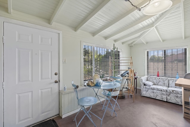 interior space with vaulted ceiling with beams