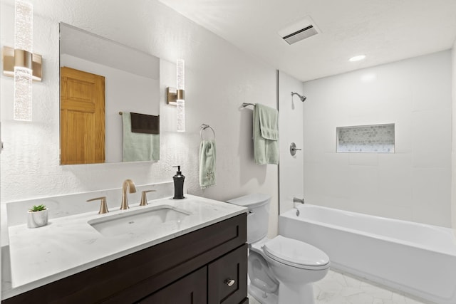 full bathroom featuring vanity, toilet, marble finish floor, shower / washtub combination, and visible vents