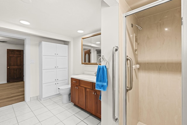 full bath featuring tile patterned flooring, vanity, toilet, recessed lighting, and a shower stall