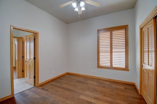 3728 Spyglass Loop SE, Rio Rancho, NM 87124 - unfurnished bedroom featuring wood finished floors, baseboards, and ceiling fan