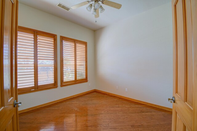 3728 Spyglass Loop SE, Rio Rancho, NM 87124 - spare room with a ceiling fan, baseboards, light wood finished floors, and visible vents
