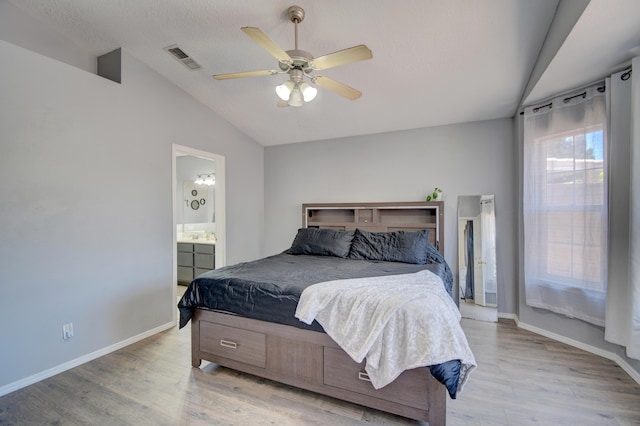 9811 Saragossa St NW, Albuquerque, NM 87114 - bedroom with baseboards, visible vents, light wood-style flooring, and lofted ceiling