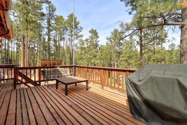 wooden terrace with area for grilling