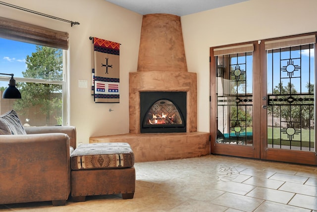 3101 Rachel Ct NE, Rio Rancho, NM 87144 - living area with healthy amount of natural light, french doors, and a high end fireplace