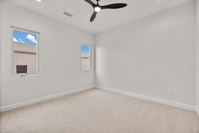 1232 21st Ave SE, Rio Rancho, NM 87124 - carpeted spare room with a ceiling fan, baseboards, and a wealth of natural light