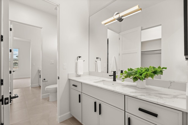 1232 21st Ave SE, Rio Rancho, NM 87124 - bathroom featuring toilet, baseboards, tile patterned floors, and vanity