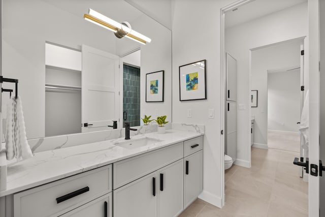 1232 21st Ave SE, Rio Rancho, NM 87124 - full bathroom with vanity, baseboards, and toilet