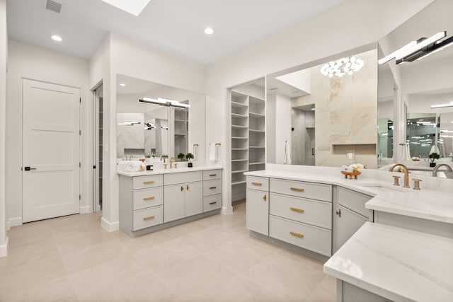 1232 21st Ave SE, Rio Rancho, NM 87124 - bathroom featuring visible vents, walk in shower, vanity, a closet, and recessed lighting