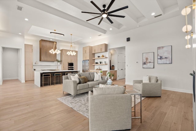 1232 21st Ave SE, Rio Rancho, NM 87124 - living area featuring baseboards, ceiling fan with notable chandelier, and visible vents