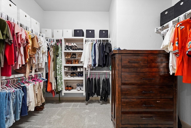 walk in closet featuring carpet