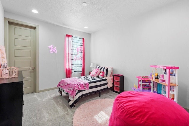 carpeted bedroom with baseboards, recessed lighting, and a textured ceiling