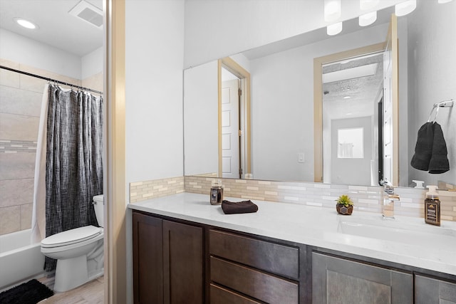bathroom featuring vanity, visible vents, toilet, backsplash, and shower / bath combo