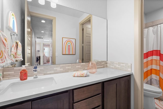 full bath featuring vanity, backsplash, visible vents, and toilet