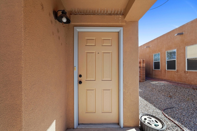 7700 Briar Ridge Ave NW, Albuquerque, NM 87114 - property entrance featuring stucco siding
