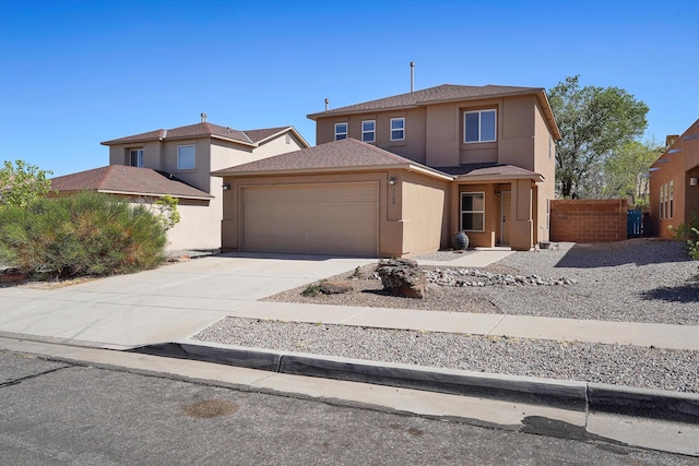 7700 Briar Ridge Ave NW, Albuquerque, NM 87114 - view of front of home with fence, stucco siding, a shingled roof, concrete driveway, and an attached garage