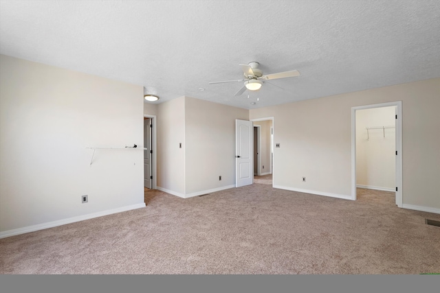 7700 Briar Ridge Ave NW, Albuquerque, NM 87114 - empty room with baseboards, light carpet, and a ceiling fan