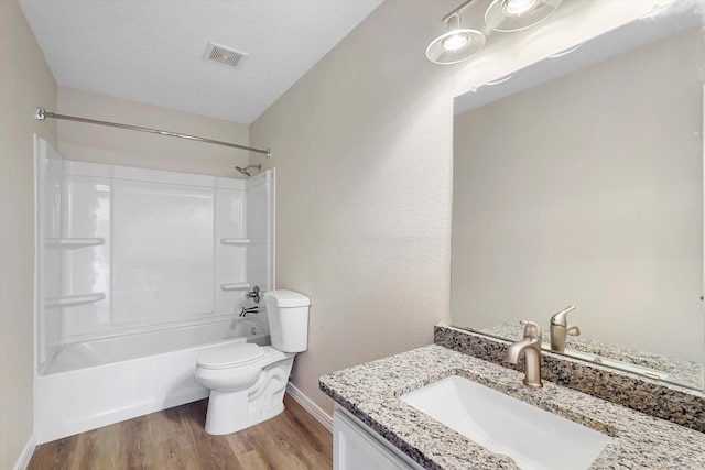 7700 Briar Ridge Ave NW, Albuquerque, NM 87114 - full bathroom featuring visible vents, wood finished floors, vanity, baseboards, and toilet
