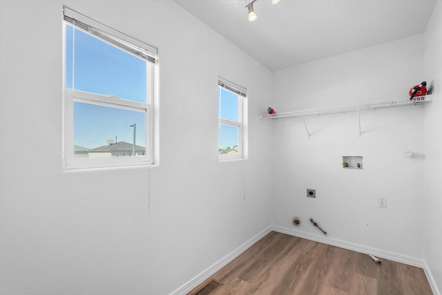 7700 Briar Ridge Ave NW, Albuquerque, NM 87114 - laundry room featuring hookup for an electric dryer, laundry area, visible vents, baseboards, and hookup for a washing machine