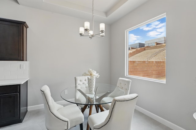 1718 Tesoro Loop NW, Los Lunas, NM 87031 - dining space featuring a chandelier, baseboards, and light tile patterned floors