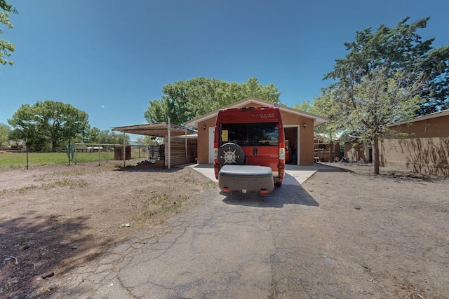 view of front of property featuring fence