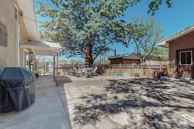 view of patio / terrace with a fenced backyard, outdoor dining area, and area for grilling