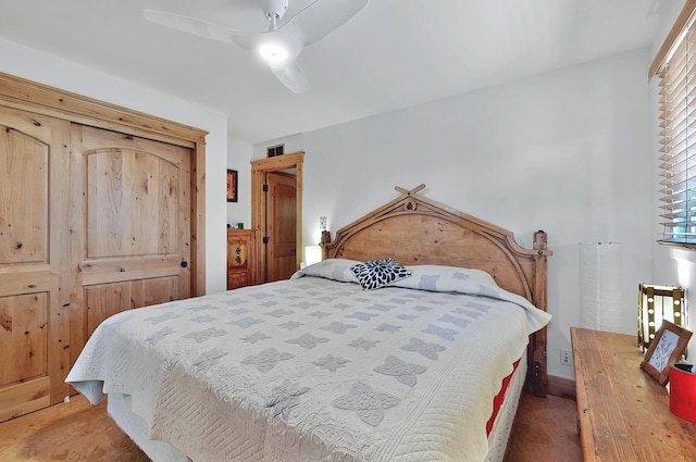 bedroom with visible vents, a ceiling fan, and multiple windows