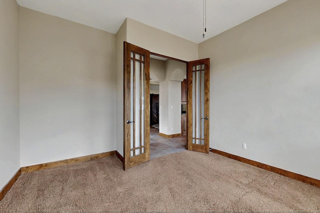 2413 Desert View Rd NE, Rio Rancho, NM 87144 - carpeted spare room featuring french doors and baseboards