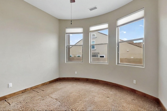 2413 Desert View Rd NE, Rio Rancho, NM 87144 - spare room with carpet floors, baseboards, and plenty of natural light