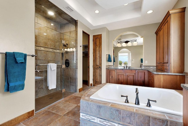2413 Desert View Rd NE, Rio Rancho, NM 87144 - bathroom with a garden tub, a shower stall, vanity, baseboards, and recessed lighting
