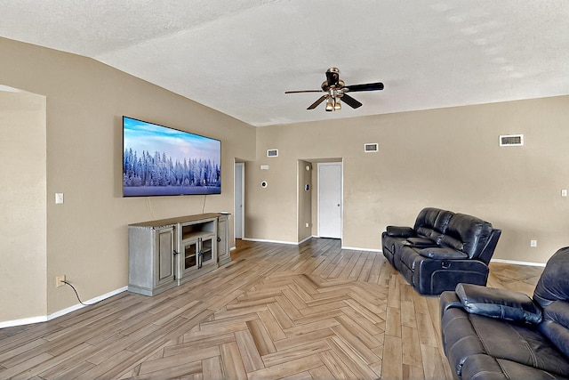 5401 Crown Ridge Rd NW, Albuquerque, NM 87114 - living room with a ceiling fan, baseboards, parquet floors, and a textured ceiling