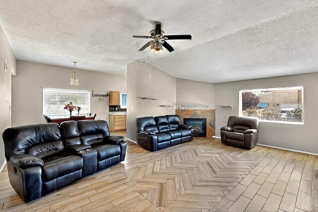 5401 Crown Ridge Rd NW, Albuquerque, NM 87114 - living area featuring baseboards, ceiling fan, healthy amount of natural light, parquet floors, and a textured ceiling