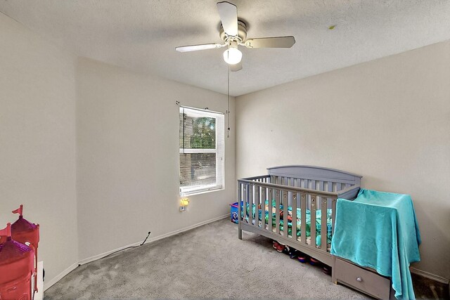 5401 Crown Ridge Rd NW, Albuquerque, NM 87114 - bedroom with carpet floors, baseboards, a textured ceiling, and a ceiling fan
