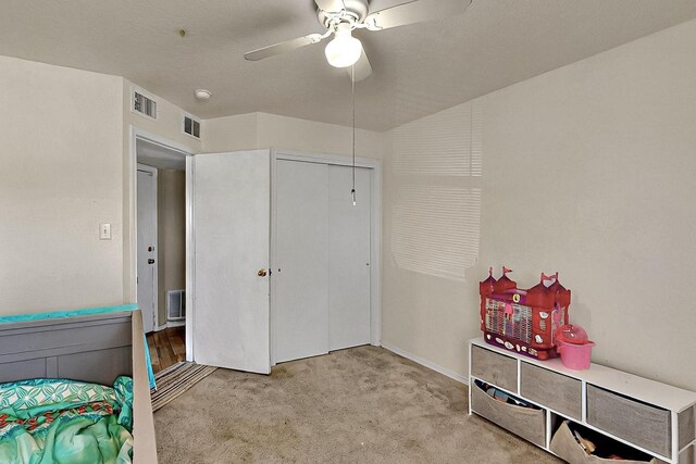 5401 Crown Ridge Rd NW, Albuquerque, NM 87114 - carpeted bedroom featuring a closet and ceiling fan