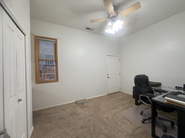 carpeted home office featuring a ceiling fan, baseboards, and visible vents