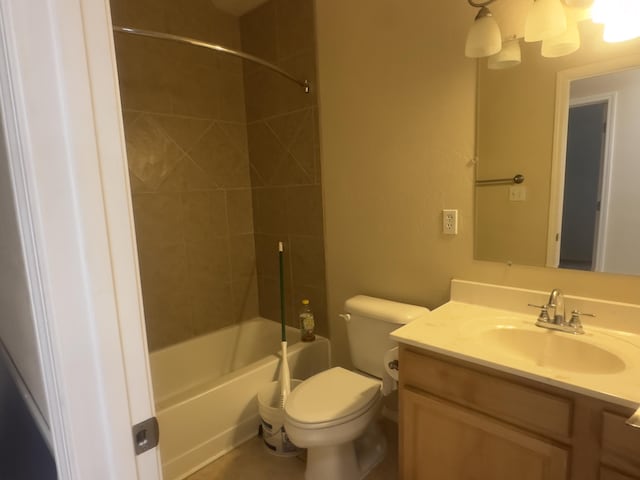 bathroom featuring toilet, tub / shower combination, and vanity