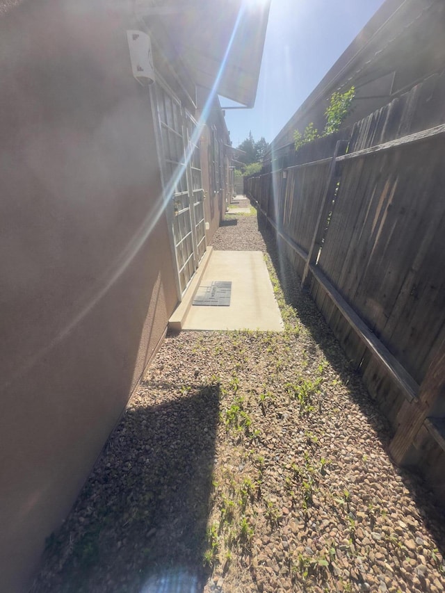 view of yard with fence and a patio area