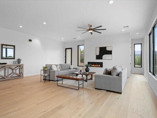 19 Anasazi Trl, Sandia Park, NM 87047 - living room with recessed lighting, visible vents, and light wood-style flooring
