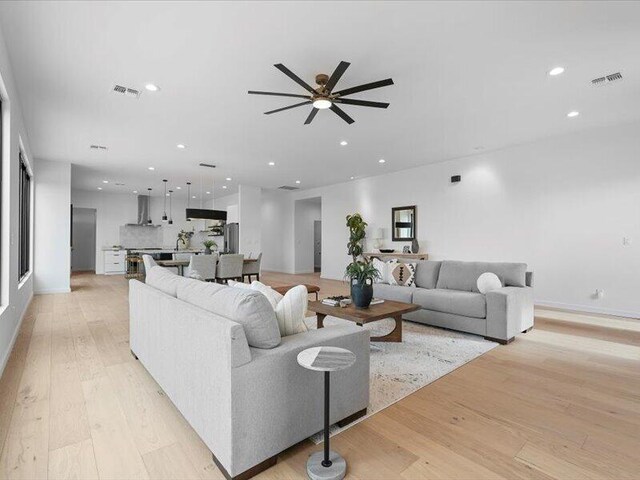 19 Anasazi Trl, Sandia Park, NM 87047 - living room featuring visible vents, recessed lighting, ceiling fan, and light wood-type flooring