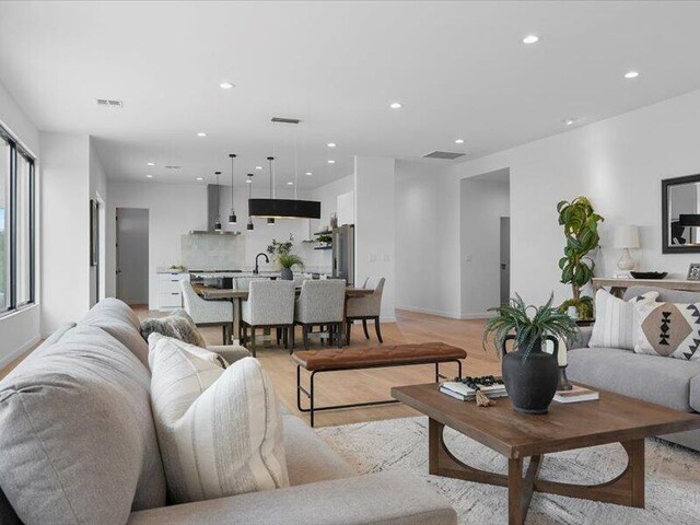 19 Anasazi Trl, Sandia Park, NM 87047 - living area featuring recessed lighting, light wood-style floors, and visible vents