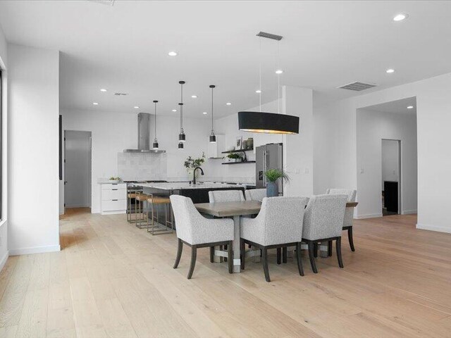 19 Anasazi Trl, Sandia Park, NM 87047 - dining space with recessed lighting, baseboards, light wood-type flooring, and visible vents