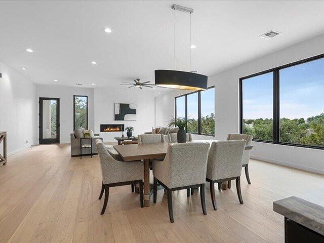 19 Anasazi Trl, Sandia Park, NM 87047 - dining space with ceiling fan, recessed lighting, light wood-style flooring, and visible vents