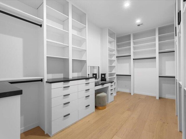 19 Anasazi Trl, Sandia Park, NM 87047 - walk in closet with light wood finished floors and visible vents