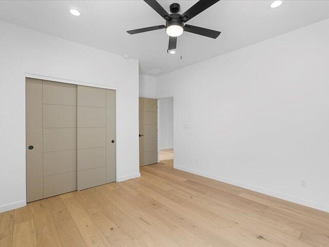 19 Anasazi Trl, Sandia Park, NM 87047 - unfurnished bedroom with a closet, recessed lighting, light wood-style flooring, and baseboards