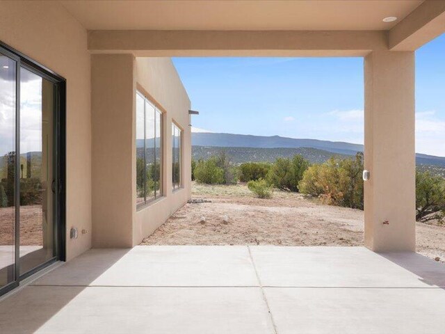 19 Anasazi Trl, Sandia Park, NM 87047 - view of patio / terrace with a mountain view